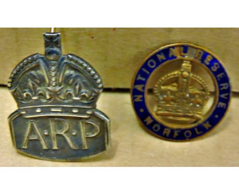 WWII A.R.P. Badge (Silver) with a Norfolk National Reserve badge (Brass and enamel). A scarce pair.