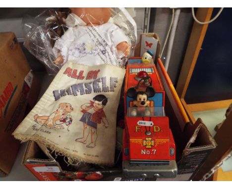 A vintage tin-plate Micky & Donald fire engine, a baby cabbage patch kid, a Corgi Proteus Campbell Bluebird plus other items 