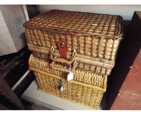A small wicker dome top trunk together with a wicker hamper
