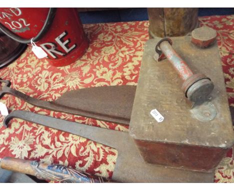 A vintage meat cleaver together with a hayrick knife and a vintage petrol can