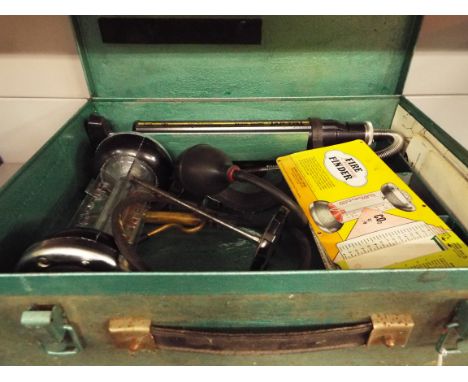 A vintage Truespot smoke tester with accessories and instructions