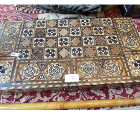 A backgammon inlaid board 