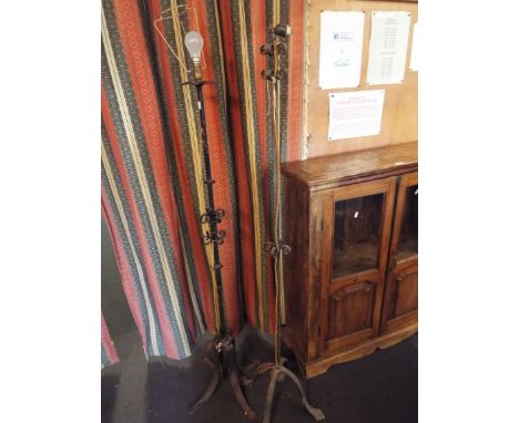 Two wrought iron lamp stands 
