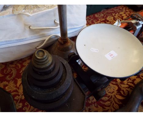 A set of vintage kitchen scales and weights and a copper wash dollie 