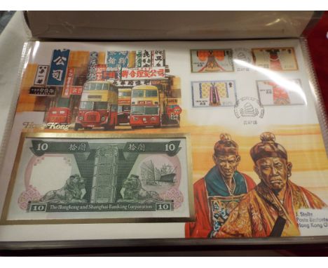 A boxed album of assorted first day covers and banknotes of the world (Bannoten-Briefe)