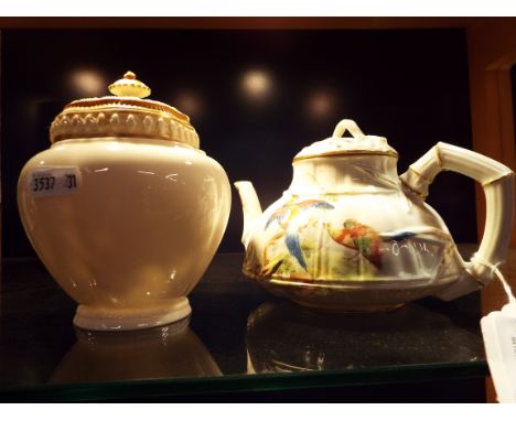 An early 20thC Royal Worcester Chinese style tea-pot decorated with Asiatic Pheasant and stylised bamboo spout and handle tog