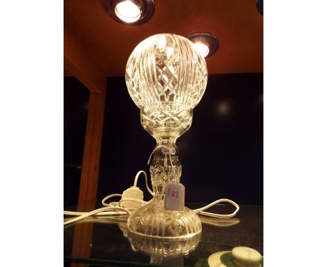A crystal glass lamp having etched bowl resting on a pedestal base     Good condition 13.5" high