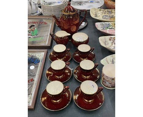 A CARLTON WARE ROUGE ROYALE COFFEE SET TO INCLUDE COFFEE SET, SUGAR BOWL, CREAM JUG, CUPS AND SAUCERS - ONE CUP A/F 