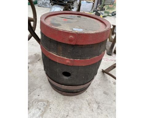 A SMALL VINTAGE WOODEN AND METAL BANDED BARREL 