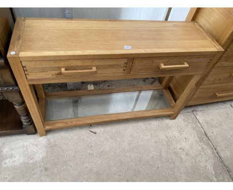 A MODERN OAK CONSOLE TABLE WITH TWO DRAWERS AND LOWER GLAZED SHELF 48" WIDE 