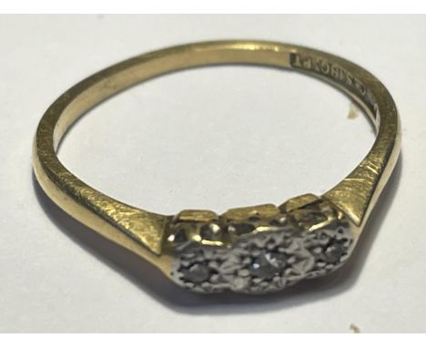 AN 18 CARAT GOLD RING WITH THREE IN LINE DIAMONDS SIZE J GROSS WEIGHT 1.96 GRAMS 