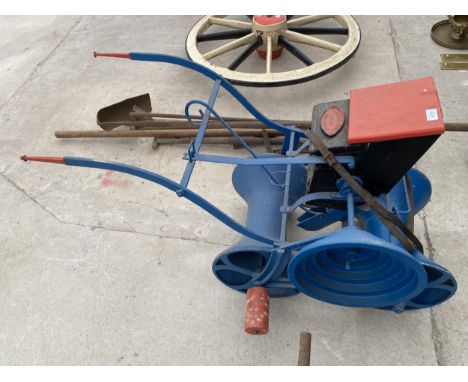A VINTAGE SEED DRILL BEARING THE NAME 'BIRCHALL BROS WHITCHURCH' 