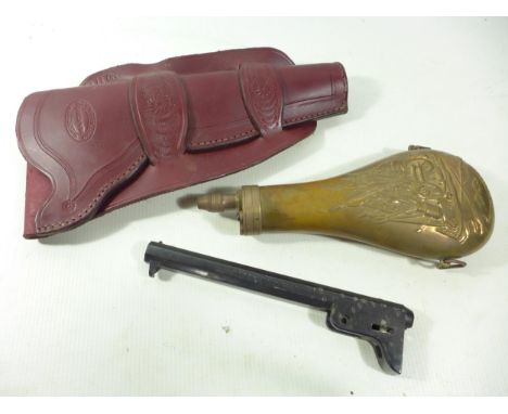 A COPPER AND BRASS POWDER FLASK, LEATHER HOLSTER AND A BLOCKED NAVY COLT BARREL (3) 