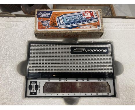 A BOXED AS NEW STYLOPHONE PLUS A RIDLEYS HONKY TONK HARMONICA 