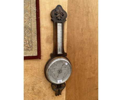 A VINTAGE WOODEN CASED ANEROID BAROMETER 