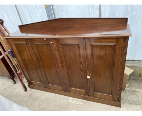 A 19TH CENTURY MAHOGANY PANELLED FOUR DOOR CABINET WITH RAISED BACK, 70.5" WIDE 