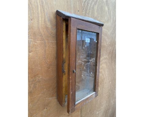 A VINTAGE WOODEN AND GLAZED WALL DISPLAY CABINET 