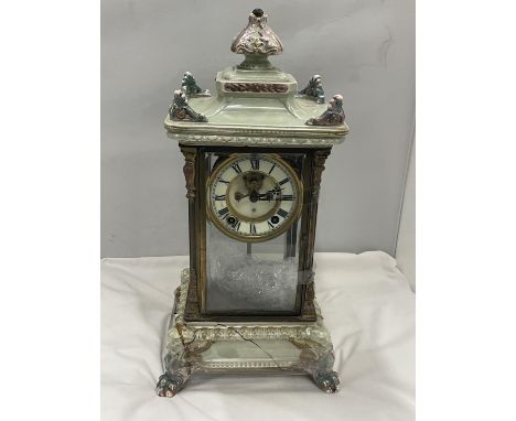 AN ANTIQUE MANTLE CLOCK WITH BEVELLED GLASS CASE WITH GLASS FRAME, PALE CERAMIC FOOTED BASE AND TOP - BASE IN NEED OF RESTORA
