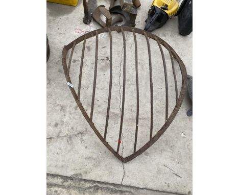A VINTAGE CAST IRON CORNER HAYRACK 