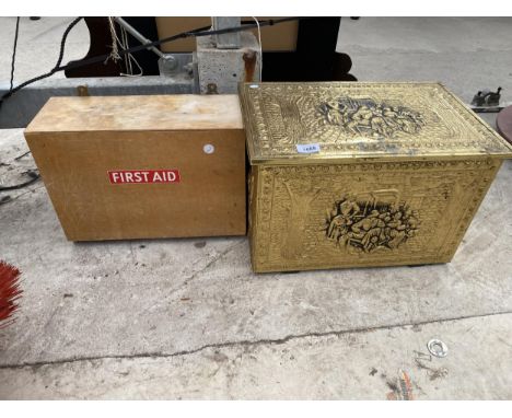 A WALL MOUNTED FIRST AID BOX AND A BRASS LOG BOX 