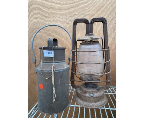 A SMALL VINTAGE MILK CHURN AND A PARAFIN LAMP 