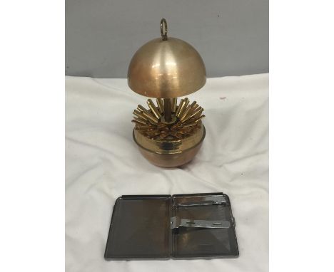 A VINTAGE 1970'S GERMAN CIGARETTE DISPENSER PLUS A CIGARETTE CASE 