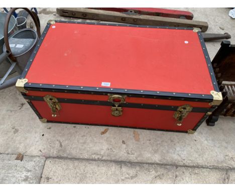 A LARGE TRAVEL TRUNK 