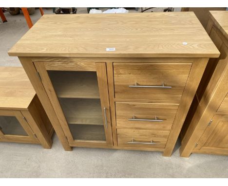 A MODERN OAK SIDE CABINET WITH GLASS DOOR AND THREE DRAWERS, 35.5" WIDE 