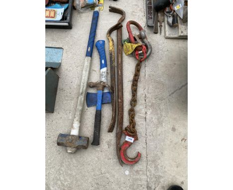 AN ASSORTMENT OF TOOLS TO INCLUDE A TOW CHAIN, CROW BARS AND A SLEDGE HAMMER ETC 