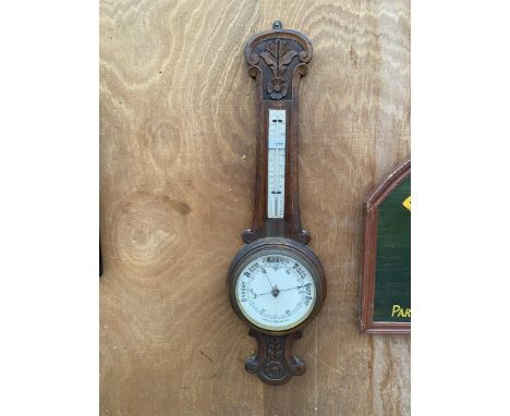 A VINTAGE WOODEN CASED ANEROID BAROMETER 