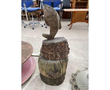 A WOODEN CARVED FISH WITH LOG RING PEDESTAL BASE 
