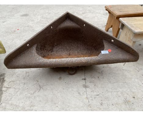 A CAST IRON CORNER FEED TROUGH PLANTER 