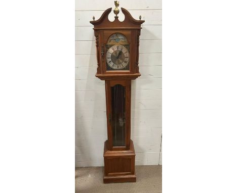 An Emperor longcase clock with acorn and eagle finials.