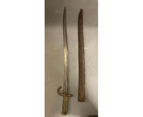 A vintage brass handled bayonet in scabbard 