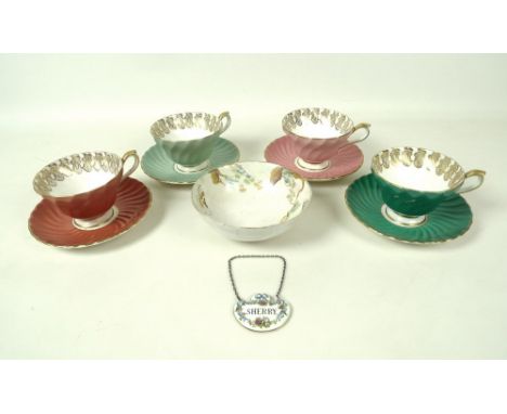 A set of four Aynsley teacups and saucers, each decorated to the outside in body colours, pink, red, mint green and darker gr