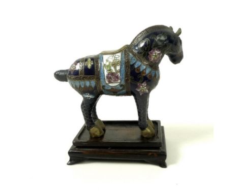 A Chinese cloisonne enamel model of a horse, early to mid 20th century, with brass hooves, the body decorated with flowers, 1