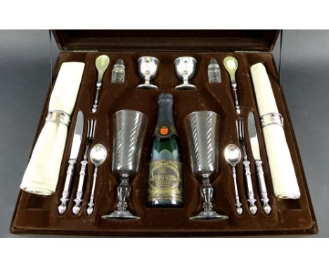 A 20th century silver and silver plate champagne breakfast set by Christoph Widmann, complete with egg cups, napkins and napk