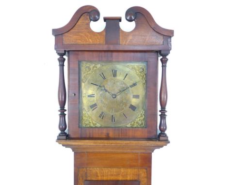 An early 19th century oak long case clock, engraved brass dial with applied spandrels, 30 hour movement chiming on a bell, ho