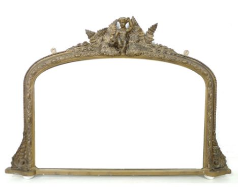 A Victorian gilt framed overmantel mirror, arched rectangular plate, figural surmount in a floral and foliate surround, on sm