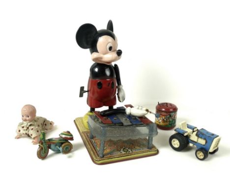 A Mickey Mouse 'Mickey the Musician' xylophone playing toy, by Louis Marx, wind up mechanism, tin base and plastic body, a/f,