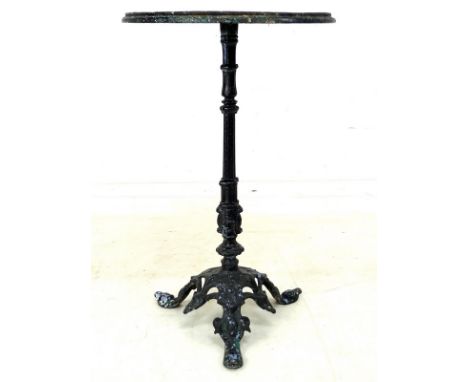 A Victorian cast iron garden table, circular white enamel surface, slender column and tripod base, cast factory marks to unde