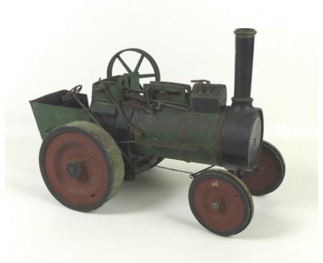 A scratch-made wooden traction engine, circa 1920, with moving brakes and steering, painted green and black, 41 by 20 by 29.5