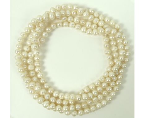 A string of cream coloured pearls, of similar shapes and size, including button pearls and ringed pearls, each pearl approxim
