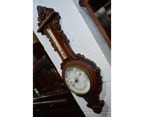 A 20TH CENTURY CARVED MAHOGANY ANEROID BAROMETER