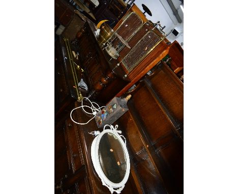 TWO PAINTED OVAL WALL MIRRORS, decorative table lamp and a quantity of brass including a fire screen (8)