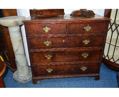 A GEORGIAN OAK CHEST, of two short and three long drawers, with brass handles, on bracket feet, approximate size width 106cm 