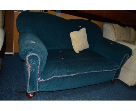 AN EDWARDIAN UPHOLSTERED SOFA