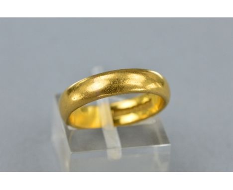 A 22CT BAND, ring size L, approximate weight 6.4 grams