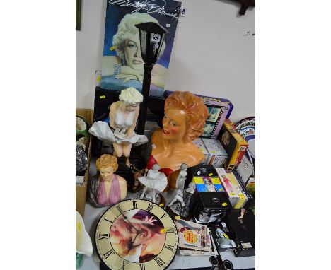 MARALYN MONROE, a collection of ornaments, plaster bust, table lamp, wall clocks, DVD's, pictures, postcards etc to include D