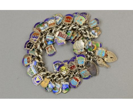 A SILVER CHARM BRACELET WITH A NUMBER OF ENAMEL BADGES, approximate weight 148 grams
